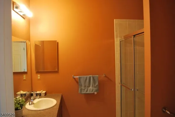 a kitchen with a refrigerator a stove and a sink