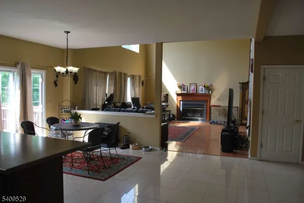 a living room with furniture and kitchen view