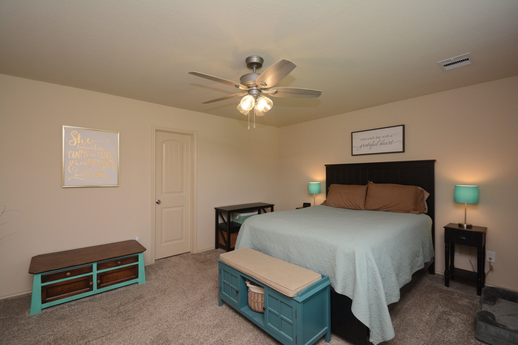 23318 Dukes Run Drive Spring, TX 77373 - Photo 4 of 41 This cozy bedroom features soft carpet, and a ceiling fan. The room has a warm and inviting atmosphere.