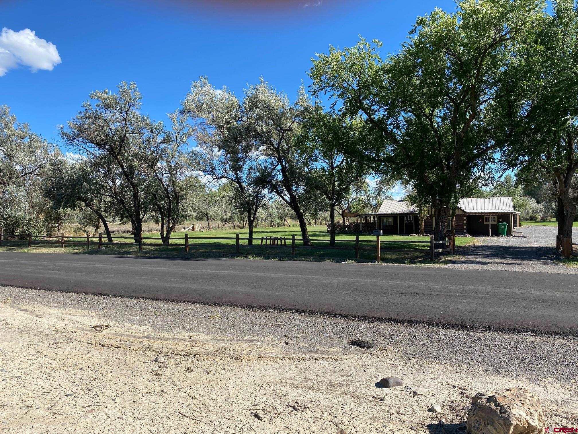 Restricted Address Montrose, CO 81401 - Photo 1 of 10 a view of road with trees