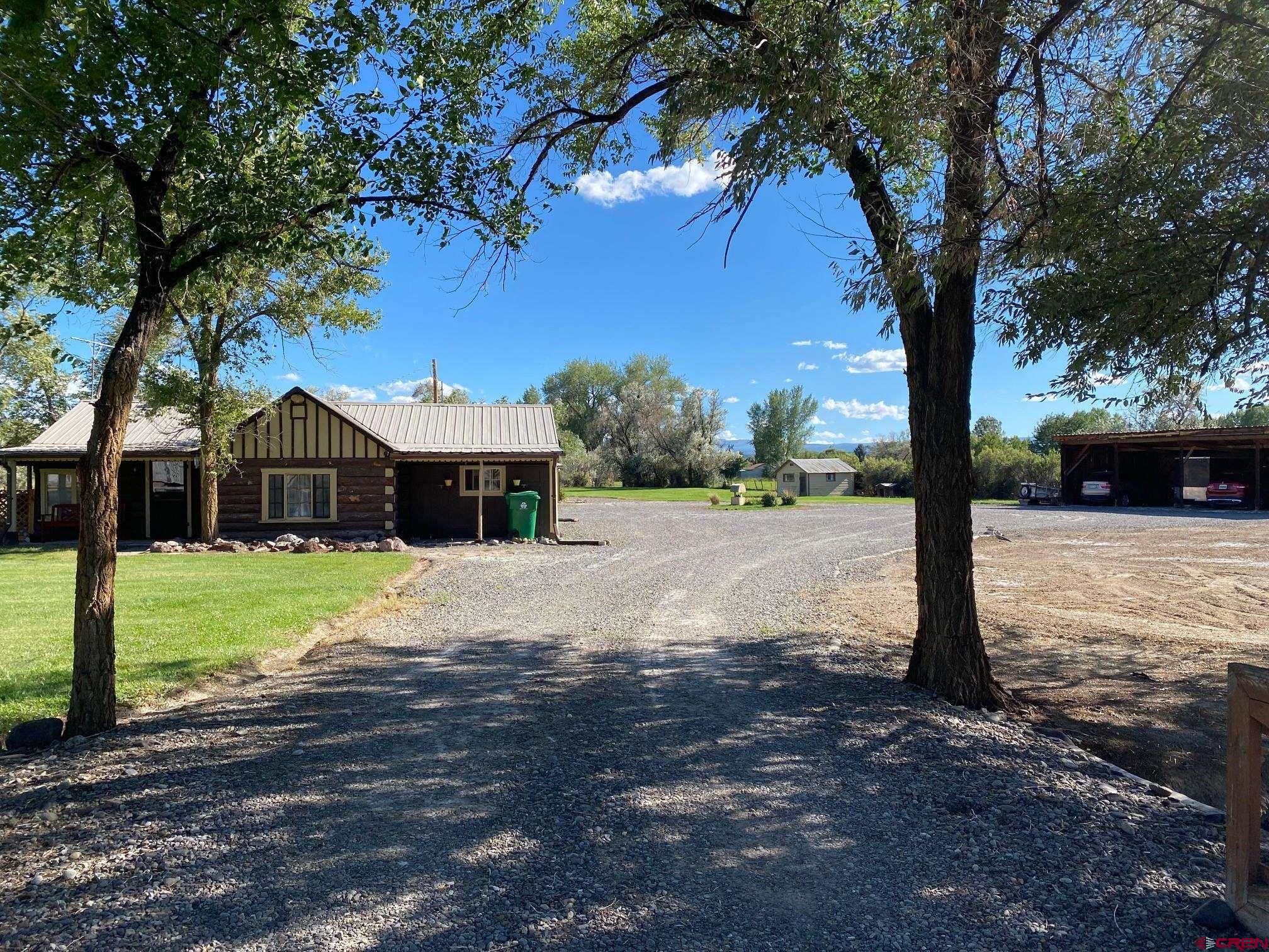 1934 Odelle Road Montrose, CO 81401 - Photo 9 of 10 a front view of a house with a yard
