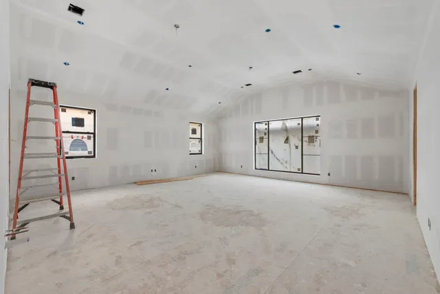 an empty room with windows