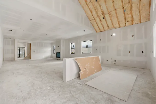 a kitchen with stainless steel appliances kitchen island a stove and a refrigerator
