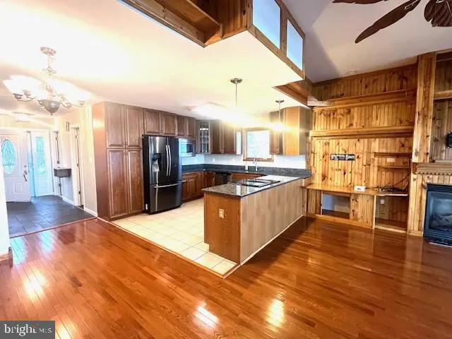a kitchen with granite countertop a sink and a stove