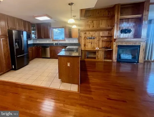 a stove top oven sitting inside of a kitchen