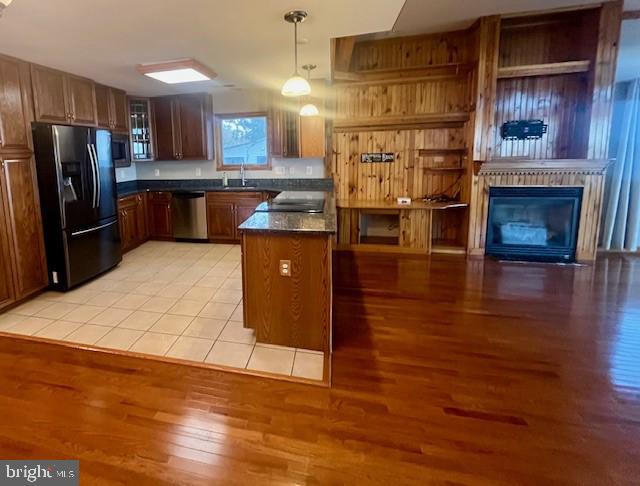 117 Chesapeake Avenue Prince Frederick, MD 20678 - Photo 21 of 65 a kitchen with stainless steel appliances granite countertop a refrigerator a stove and a wooden floors