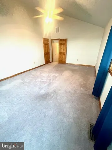 a bedroom with a bed and a cabinets