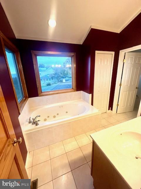 117 Chesapeake Avenue Prince Frederick, MD 20678 - Photo 35 of 65 a bathroom with a bathtub sink and mirror