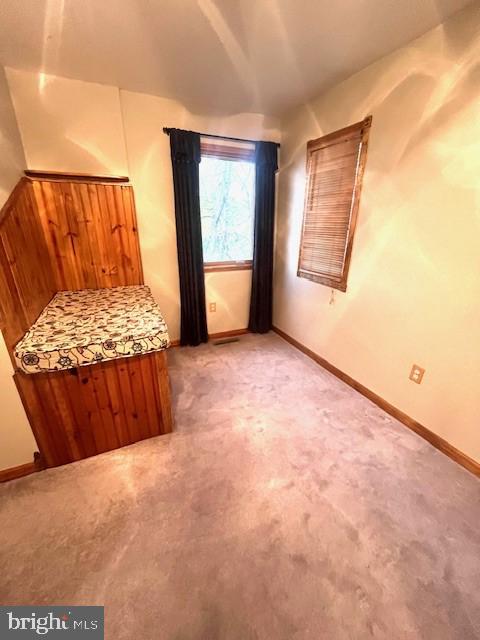 117 Chesapeake Avenue Prince Frederick, MD 20678 - Photo 41 of 65 a view of a bedroom with wooden floor and windows