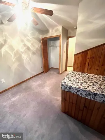 a view of a house with a yard and a deck