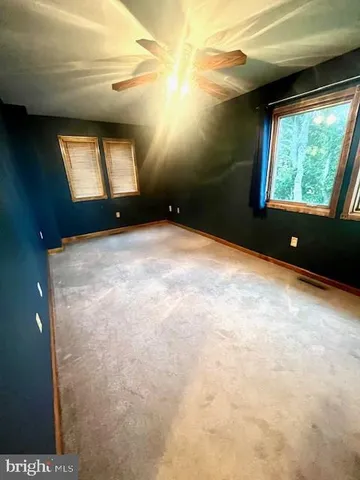 a balcony with yard and lake view