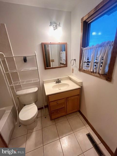 117 Chesapeake Avenue Prince Frederick, MD 20678 - Photo 44 of 65 a bathroom with a sink a toilet and mirror