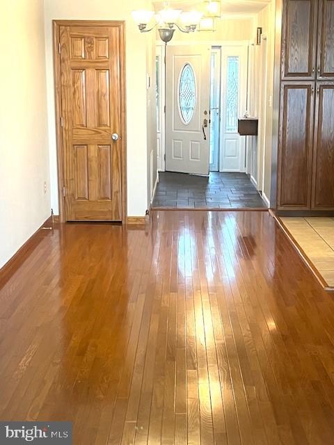 117 Chesapeake Avenue Prince Frederick, MD 20678 - Photo 46 of 65 an empty room with wooden floor and door