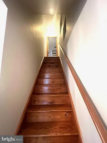 a view of a roof deck with wooden floor and fence