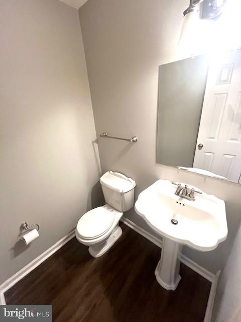 117 Chesapeake Avenue Prince Frederick, MD 20678 - Photo 65 of 65 a bathroom with a toilet sink and mirror