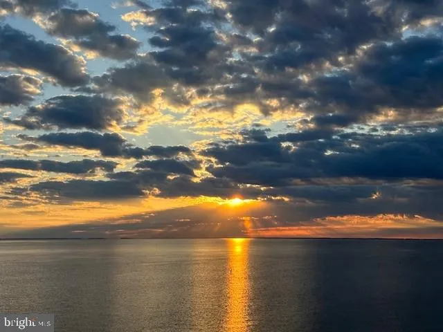 a view of a room with lots of wooden furniture