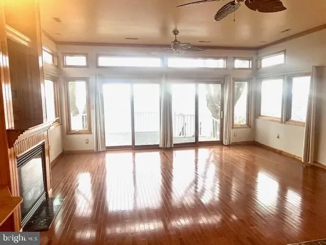 a living room with a fireplace a dining table and a fireplace