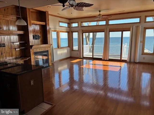 a view of a living room a fireplace and wooden floor