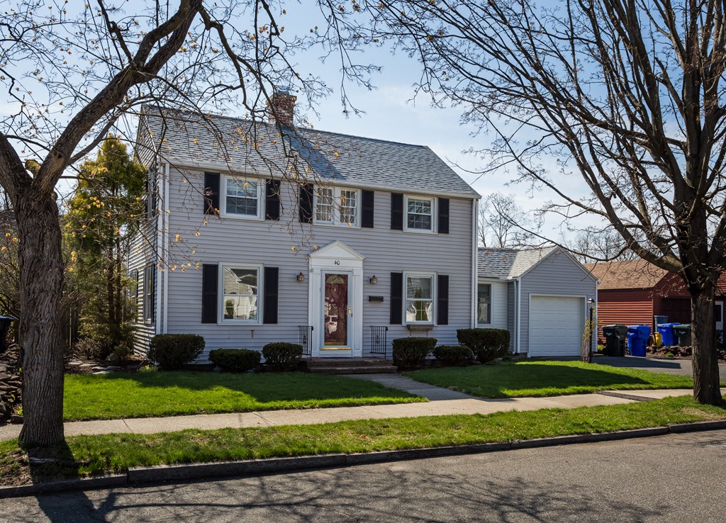 40 Oregon Street Springfield, MA 01118 - Photo 1 of 30 a front view of a house with a yard and trees