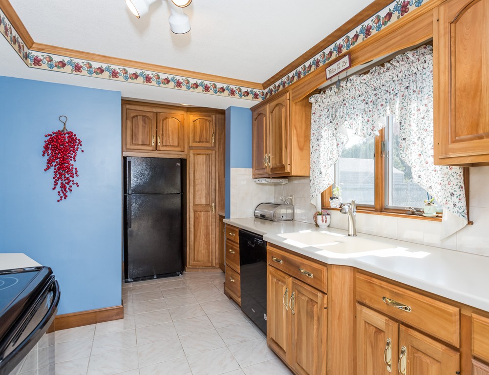 40 Oregon Street Springfield, MA 01118 - Photo 11 of 30 a kitchen with granite countertop a sink stainless steel appliances and cabinets