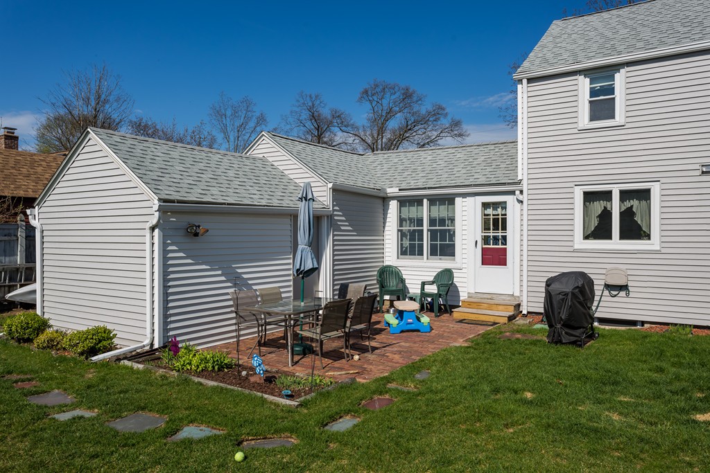 40 Oregon Street Springfield, MA 01118 - Photo 7 of 30 a backyard of a house with table and chairs