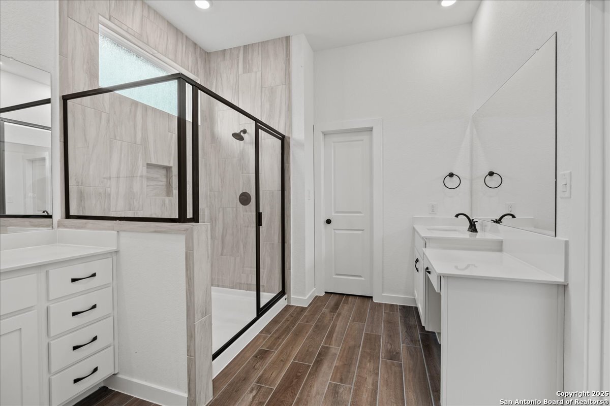 2013 Shepards Street Seguin, TX 78155 - Photo 11 of 21 a bathroom with a sink a mirror and shower