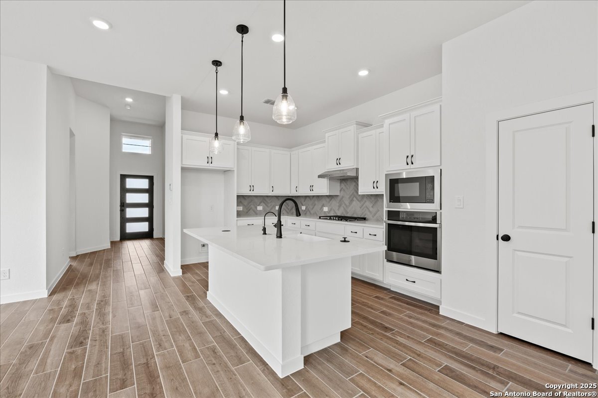 2013 Shepards Street Seguin, TX 78155 - Photo 5 of 21 a large white kitchen with stainless steel appliances