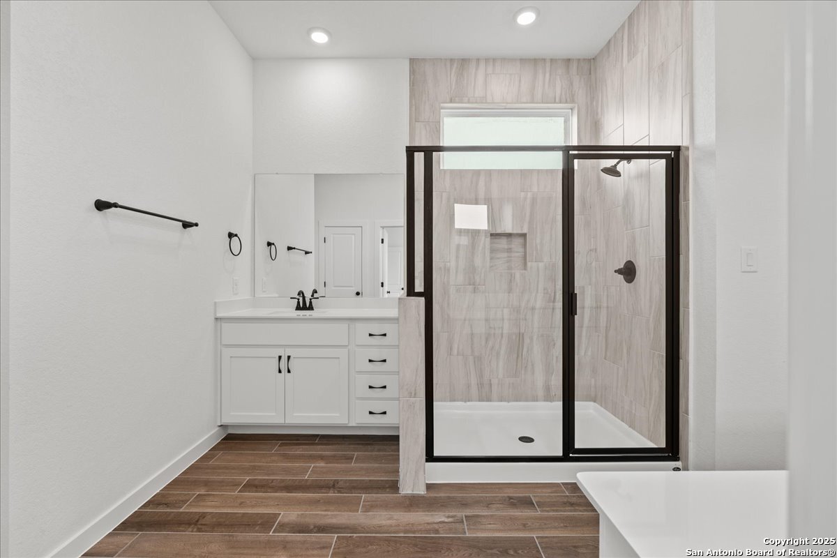 2013 Shepards Street Seguin, TX 78155 - Photo 10 of 21 a bathroom with a shower sink and mirror