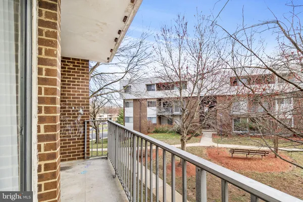 a view of a balcony with a tree
