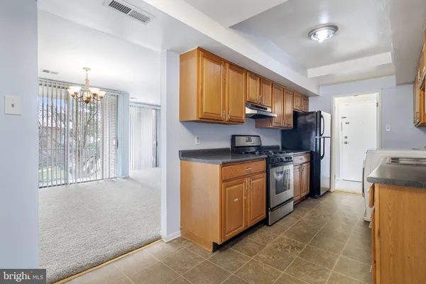 a kitchen with a cabinets and appliances