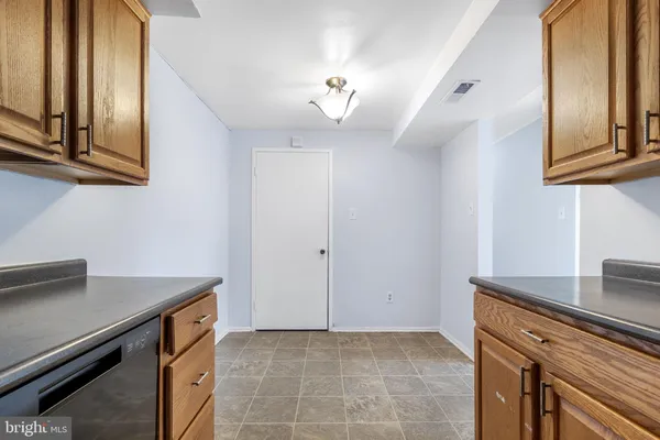 a kitchen with stainless steel appliances granite countertop a stove and a refrigerator