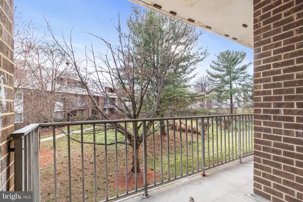 a view of a balcony with a pot
