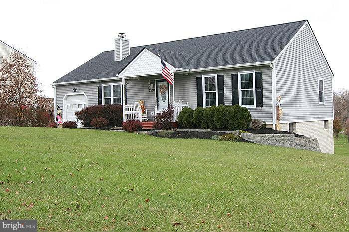 3200 Atlee Ridge Road New Windsor, MD 21776 - Photo 1 of 19 a front view of a house with a garden and plants