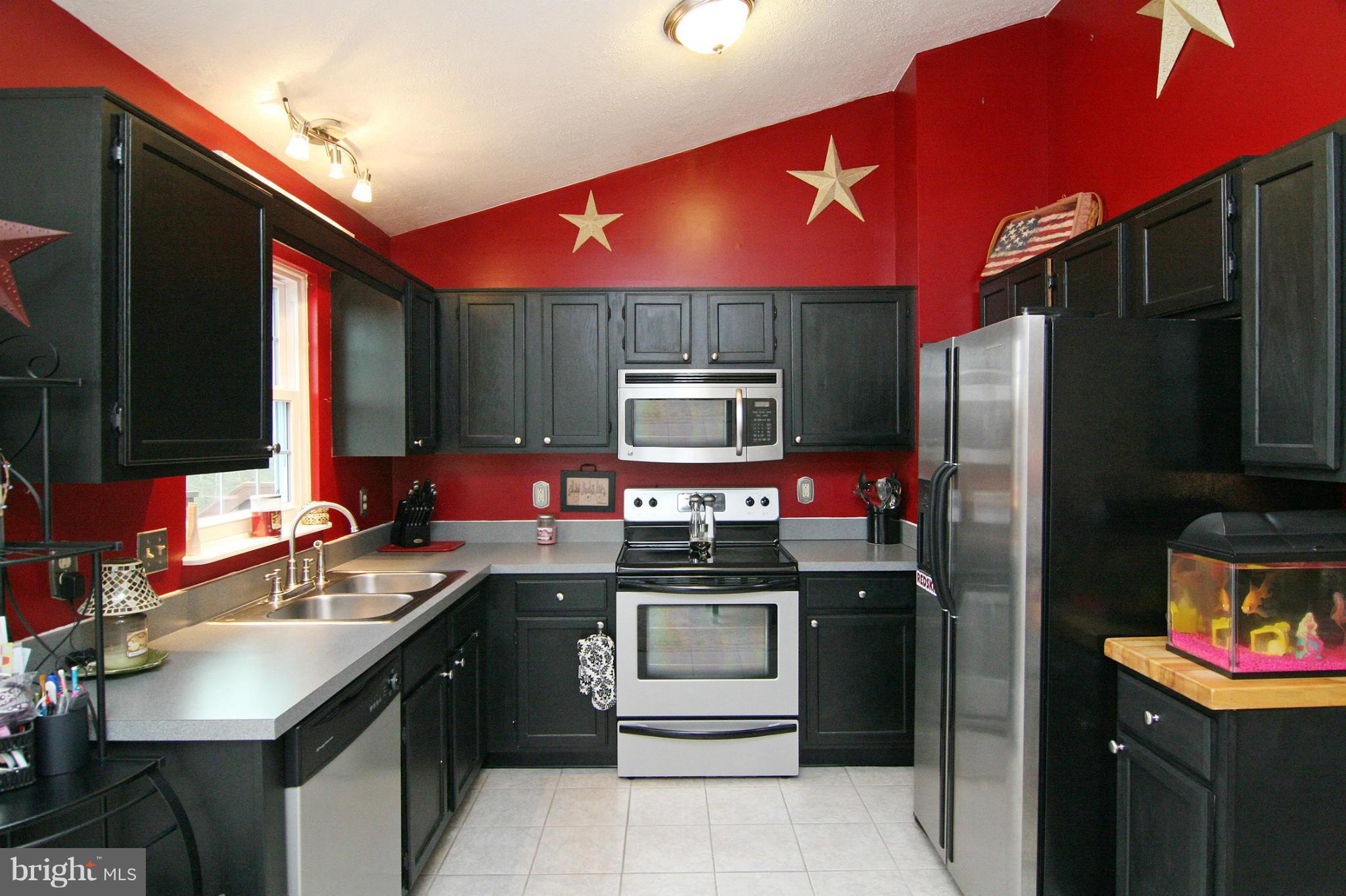 3200 Atlee Ridge Road New Windsor, MD 21776 - Photo 6 of 19 a kitchen with stainless steel appliances a sink stove and refrigerator