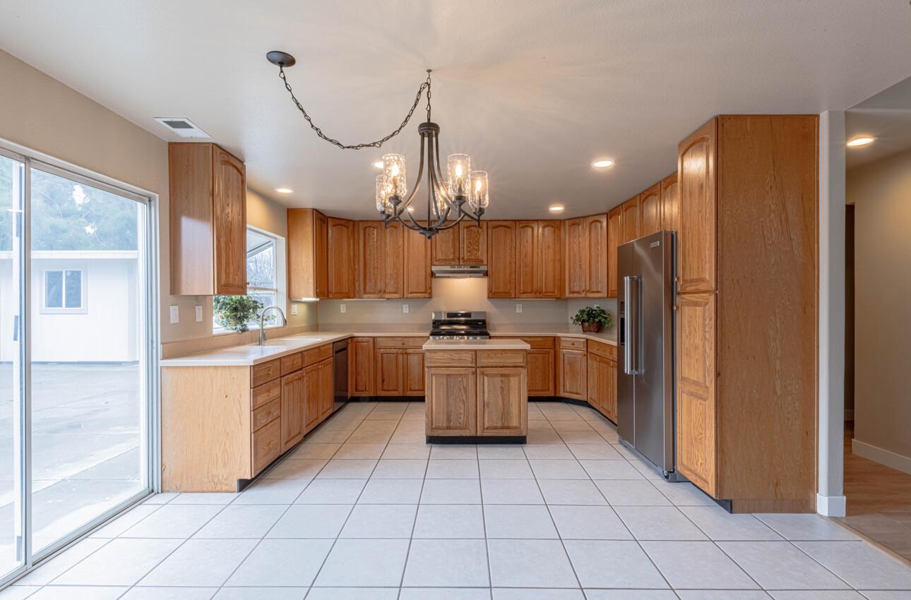 10 Rex Circle Salinas, CA 93906 - Photo 12 of 43 a kitchen with a refrigerator a sink and cabinets