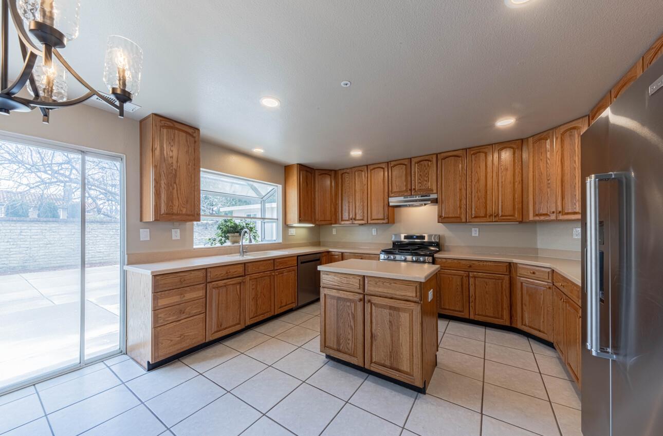 10 Rex Circle Salinas, CA 93906 - Photo 13 of 43 a kitchen with granite countertop cabinets stainless steel appliances a sink and a counter top space