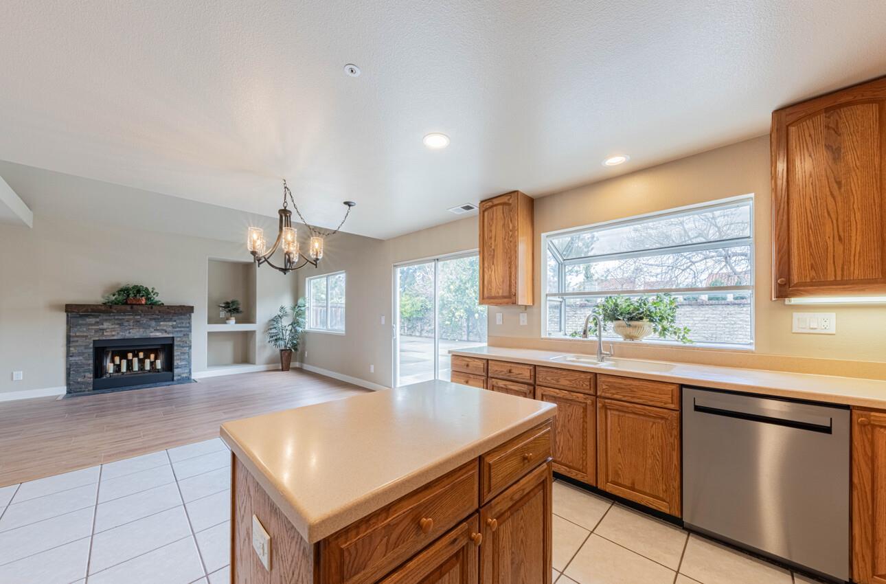 10 Rex Circle Salinas, CA 93906 - Photo 14 of 43 a kitchen with stainless steel appliances granite countertop a sink and a refrigerator