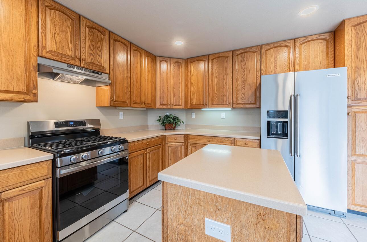 10 Rex Circle Salinas, CA 93906 - Photo 15 of 43 a kitchen with a stove a refrigerator and a sink