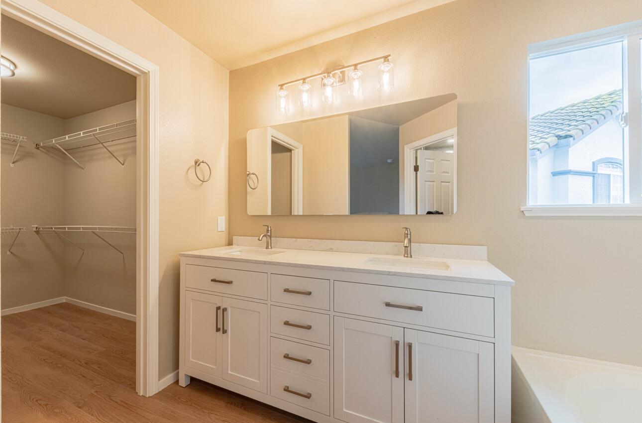 10 Rex Circle Salinas, CA 93906 - Photo 26 of 43 a bathroom with a double vanity sink and mirror