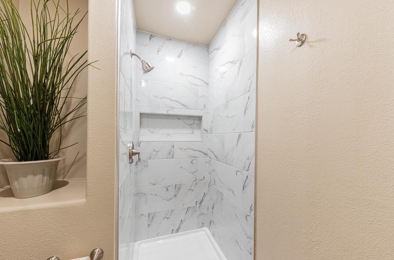 10 Rex Circle Salinas, CA 93906 - Photo 28 of 43 a bathroom with a bathtub and shower