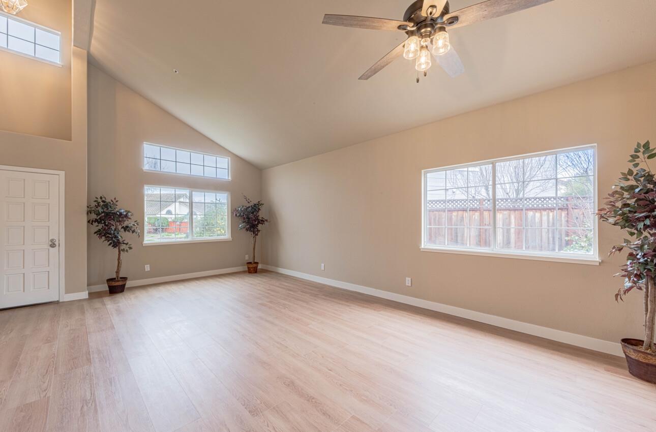 10 Rex Circle Salinas, CA 93906 - Photo 4 of 43 a view of an empty room with a window and wooden floor