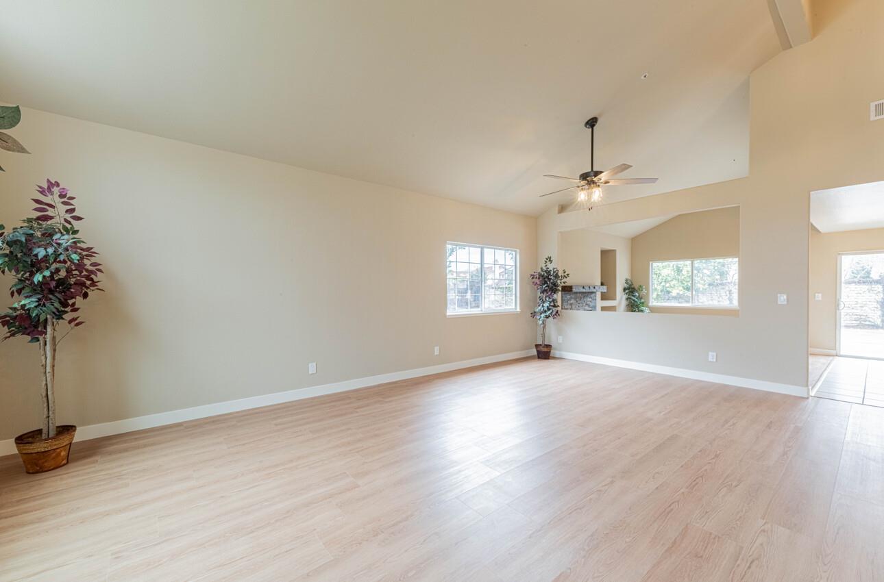 10 Rex Circle Salinas, CA 93906 - Photo 5 of 43 an empty room with windows and chandelier fan