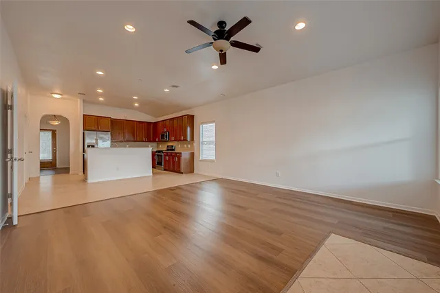 a view of a kitchen with a sink and a refrigerator
