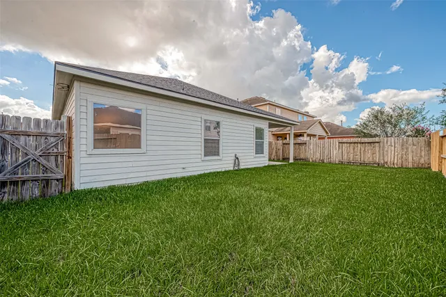 a backyard of a house with lots of green space