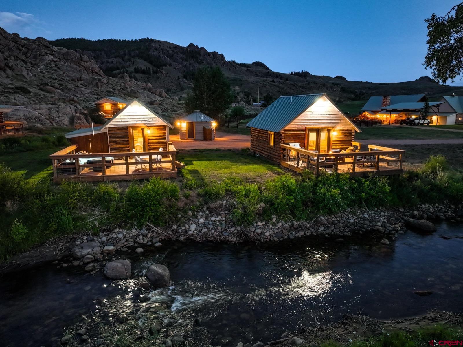 5291 County Road 76 Parlin, CO 81239 - Photo 13 of 42 a view of a house with a yard