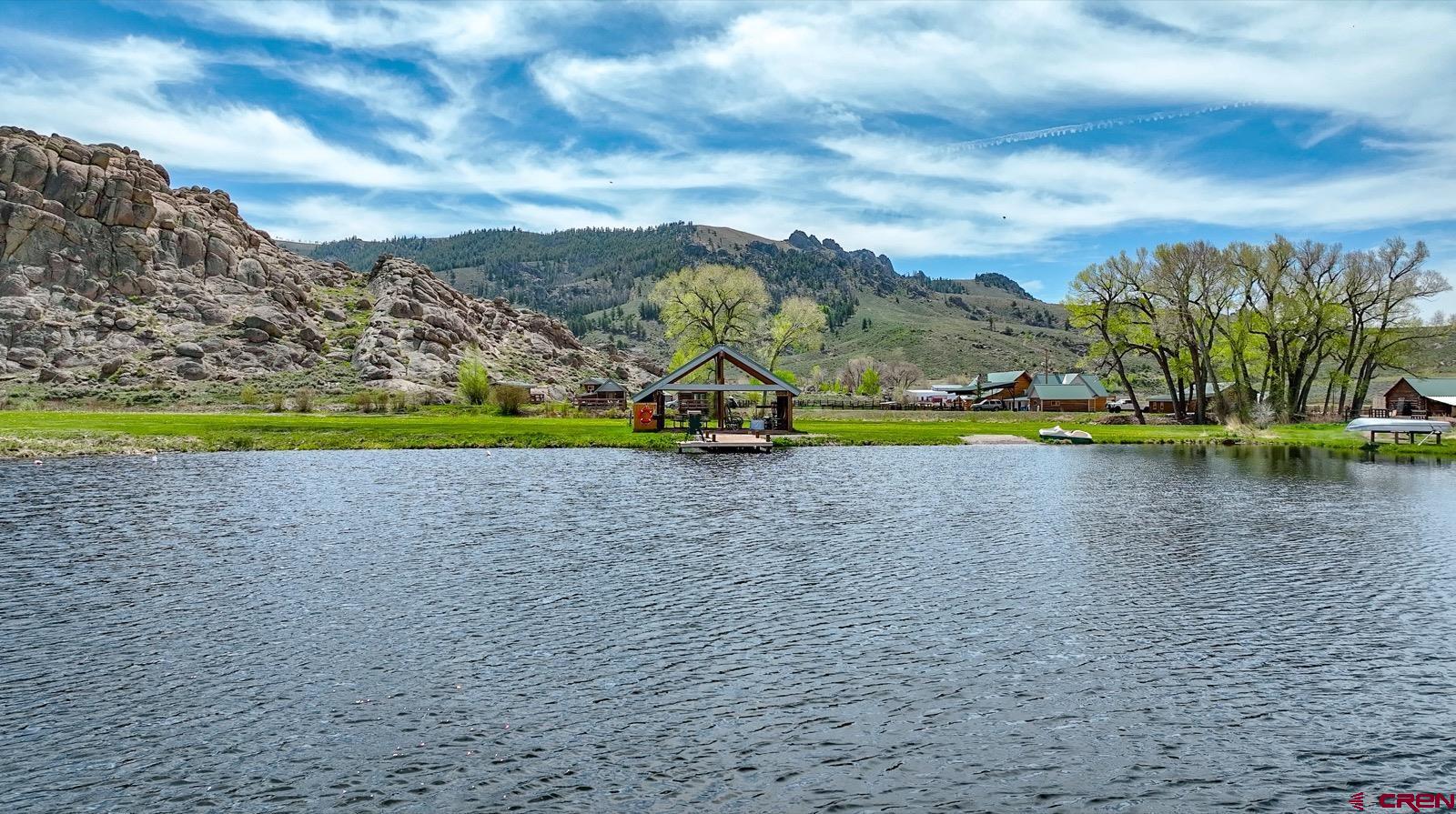 5291 County Road 76 Parlin, CO 81239 - Photo 15 of 42 a view of a lake with houses in the back