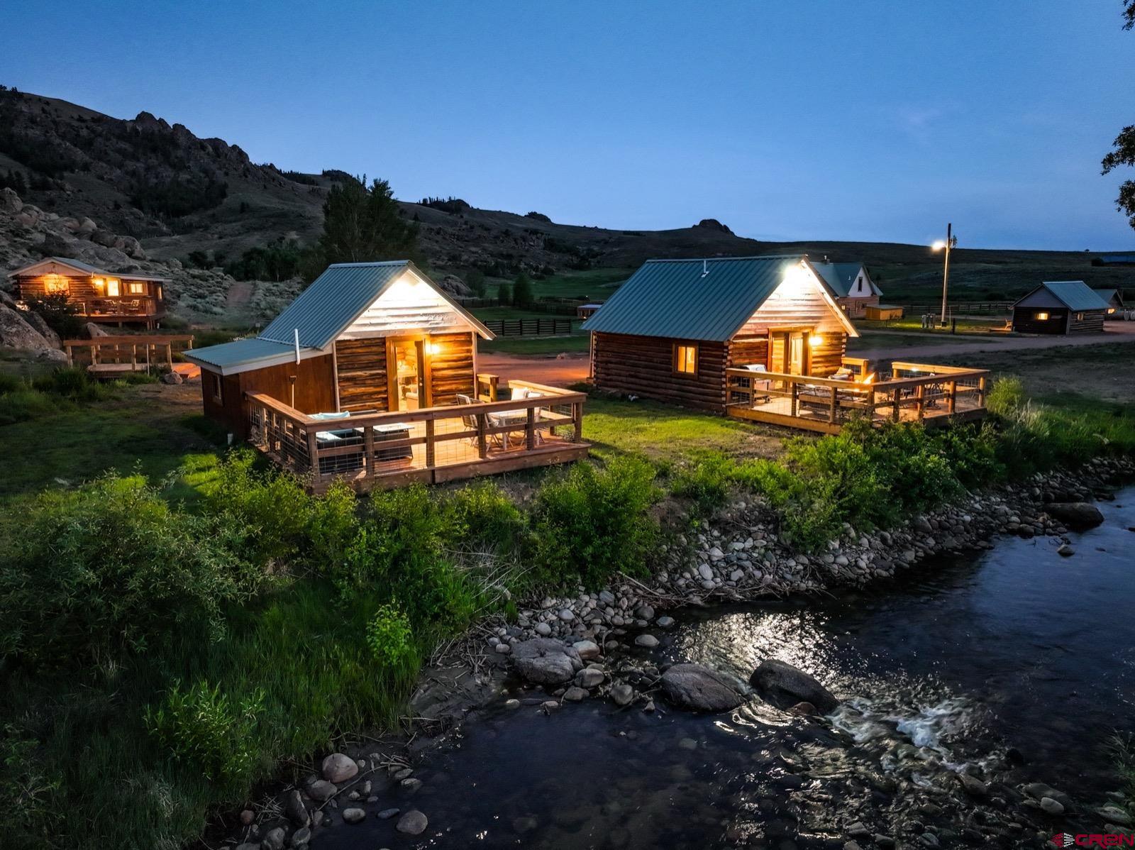 5291 County Road 76 Parlin, CO 81239 - Photo 25 of 45 a view of a house with a big yard and large tree