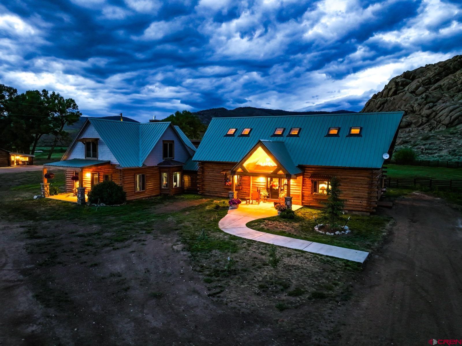 5291 County Road 76 Parlin, CO 81239 - Photo 32 of 42 a view of a house with a backyard and a tub