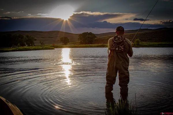 a view of a golf course with a lake