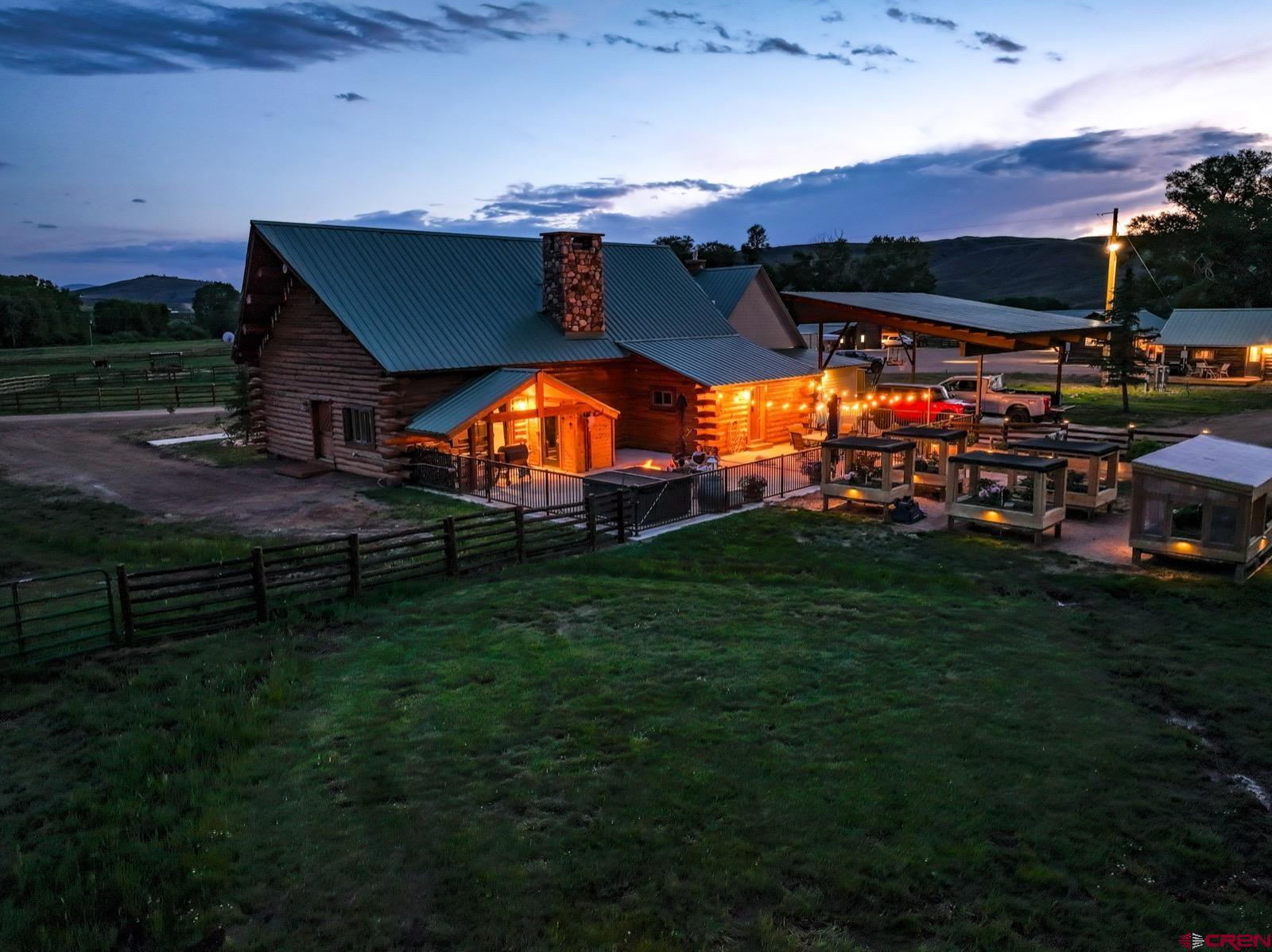 5291 County Road 76 Parlin, CO 81239 - Photo 9 of 45 a view of a chairs and table in a yard